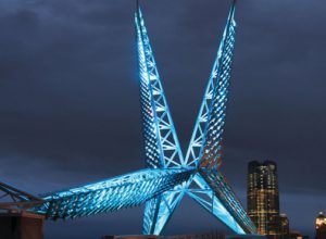 oklahoma city scissortail bridge lit up blue at night