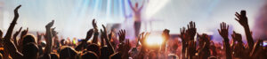 Musician receives applause from large audience at the end of a concert