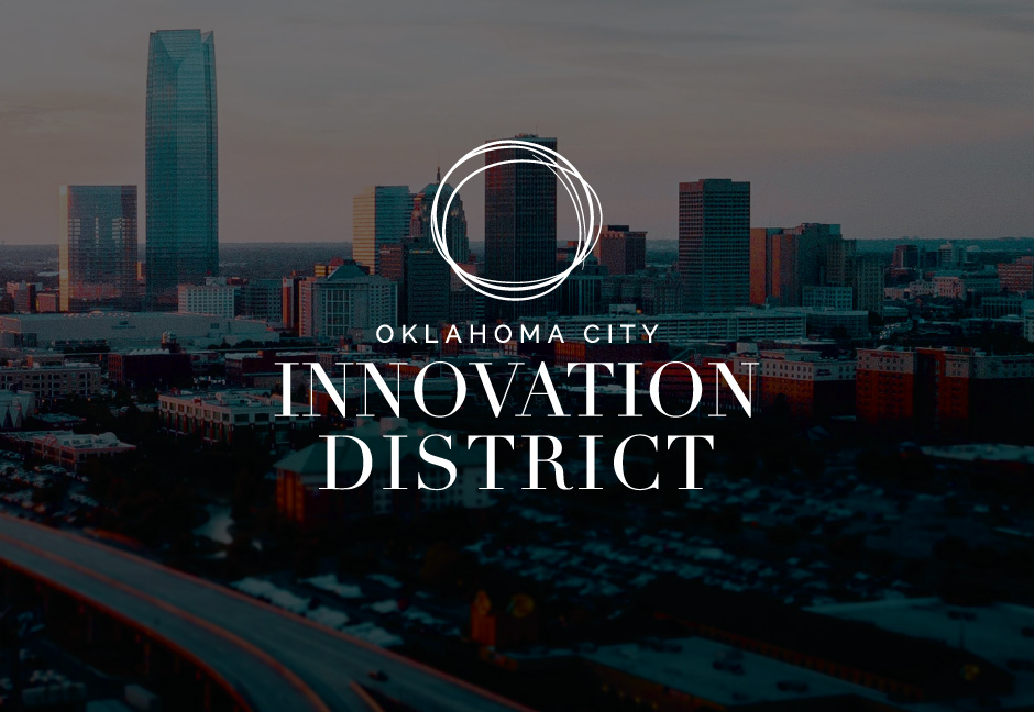 Oklahoma City Innovation District Logo over darkened background image of Oklahoma City skyline