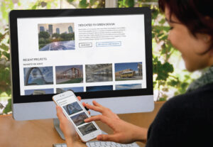 darr + collins website homepage displayed on iMac screen and smartphone screen
