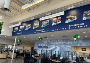 Hester Designs creates a large scale timeline for Ford F-150 trucks on display in a Ford Dealership showroom.