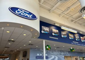 Hester Designs corporate interior branding in a beautiful Bob Moore Ford dealer showroom.