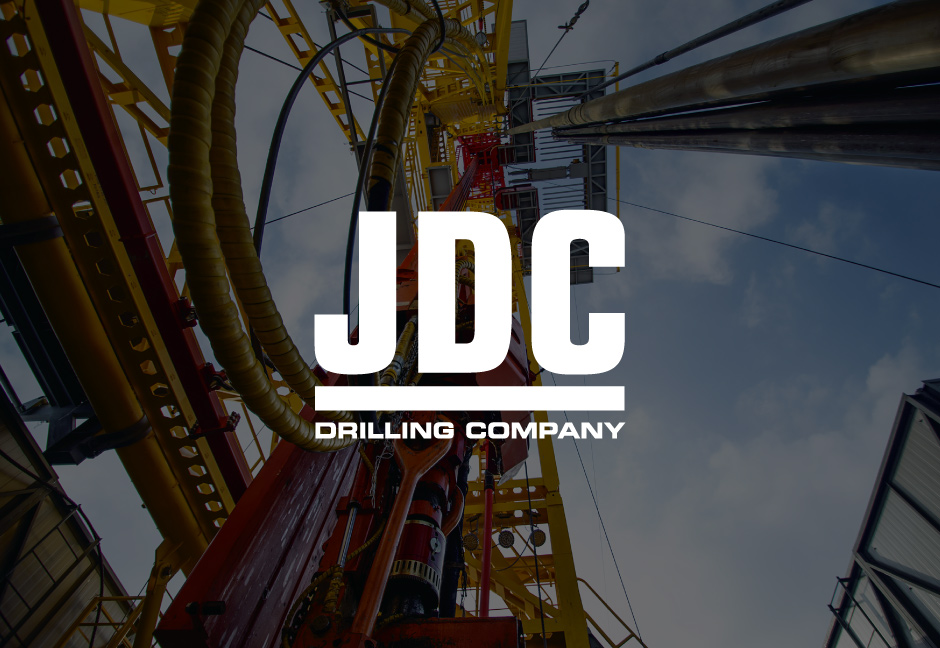 decorative background with JDC Drilling logo foregound