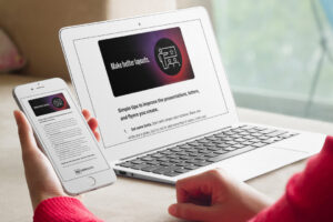 hester designs email newsletter for February 2023, mockup displayed on desktop computer and mobile phone being held in woman's hand