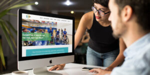 Two charity organizers review the newly designed website by Hester Designs