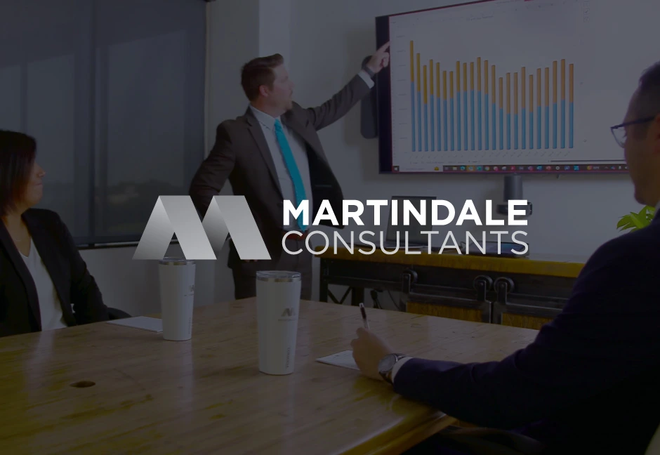 martindale consultants logo over image of martindale team in meeting