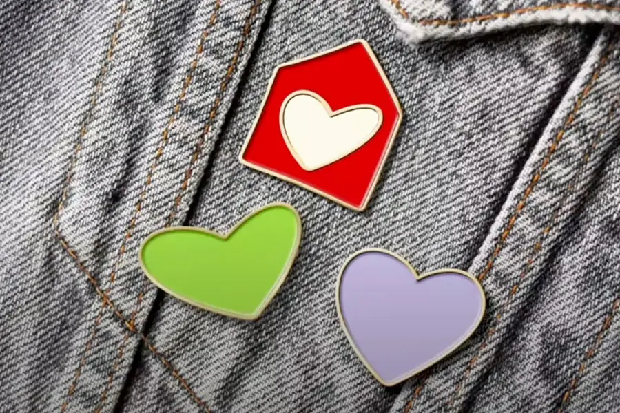 Ronald McDonald House new branding logo used as pins on a jean jacket.